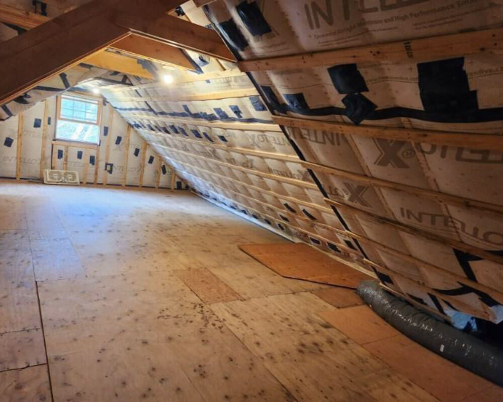 An attic space featuring insulation materials, ensuring optimal thermal insulation and energy conservation.
